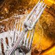 Silverware and glass dishes washed with water