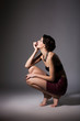 Enticing Discalced Woman Sitting on Hunkers in Reverie. Daydream