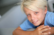 Portrait of young boy with blue eyes and shirt