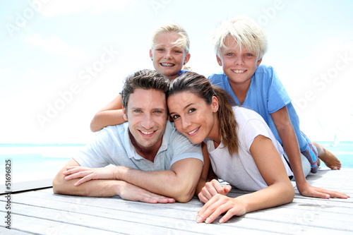 Photo: Portrait of cheerful family on vacation in Caribe Portrait of cheerful family on vacation in Caribe