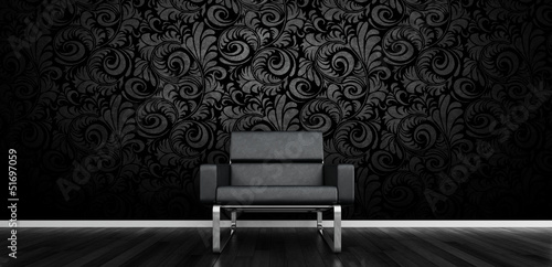 Illustration: Modern black design chair in front of dark wall Modern black design chair in front of dark wall