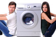 beautiful young couple with a washing machine