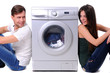 beautiful young couple with a washing machine