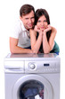 beautiful young couple with a washing machine