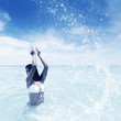 Woman splashing in sea