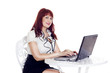 Photo: Young pretty businesswoman working on computer Young pretty businesswoman working on computer