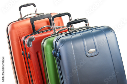 Photo: Luggage consisting of large suitcases isolated on white Luggage consisting of large suitcases isolated on white