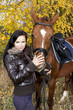 Photo: equestrian with her horse in autumnal nature equestrian with her horse in autumnal nature