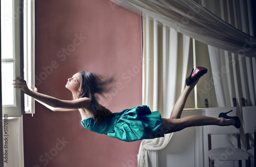 Photo: woman flying woman flying