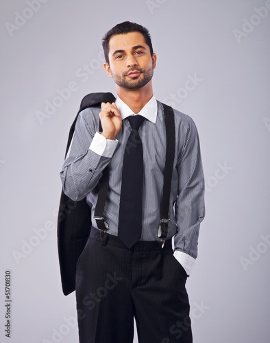 Photo: Relaxed Businessman Holding His Coat Relaxed Businessman Holding His Coat