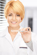 attractive female doctor with thermometer