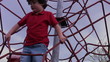 Little boy climbing at park