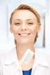 attractive female doctor with toothbrush