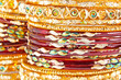 Traditional Indian bangles with different colors and patterns.