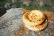 Traditional eastern lepeshka nan - white flat bread baked in old