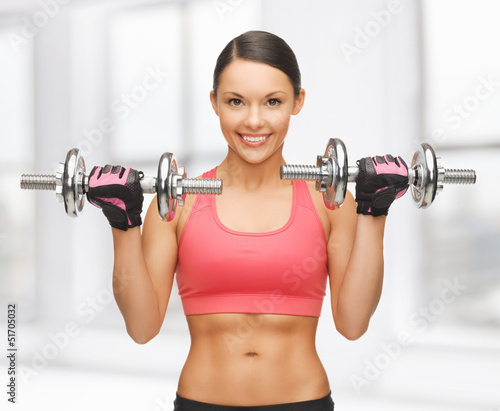 Photo: woman with dumbbells woman with dumbbells