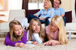 Foto: Family reading a book together Family reading a book together