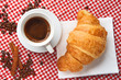Coffee with croissant and cinnamon
