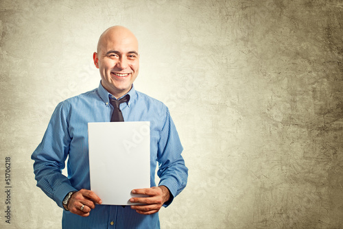 Photo: Businessman holding paper Businessman holding paper