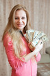 Foto: Happy woman shows US dollars Happy woman shows US dollars