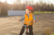 Handsome happy little boy out riding