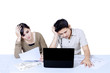 Photo: Stress couple paying bills online - isolated Stress couple paying bills online - isolated