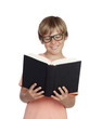 Preteen boy reading a book with glasses