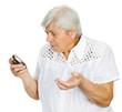 senior woman stares stunned at something she sees on her phone