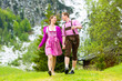 canvas print picture - Happy couple hiking in Alpine meadow