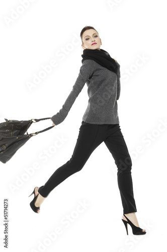 Photo: Full length of fashion model with big bag. Isolated on white Full length of fashion model with big bag. Isolated on white