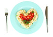 Cooked spaghetti carefully arranged in  heart shape and topped