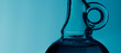 Blue bottle with drops of water
