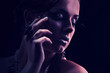Young beautiful girl naked with a coral necklace