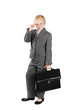 the serious girl in a business suit with a bag isolated on white