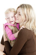 portrait of mother with her crying little daughter