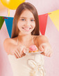 Photo: girl in birthday party with cake girl in birthday party with cake