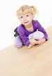 Photo: little girl playing with a doll little girl playing with a doll