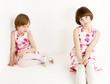 Photo: two sisters wearing similar dresses two sisters wearing similar dresses