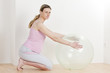 Foto: pregnant woman doing exercises with a ball pregnant woman doing exercises with a ball