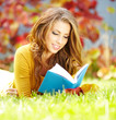 beautiful girl with book in  park