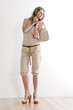 standing woman wearing summer clothes and shoes