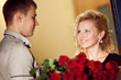 Photo: man gives roses to a girl man gives roses to a girl