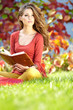 beautiful girl with book in  park