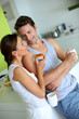 Cheerful couple enjoying breakfast time