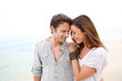 Romantic couple walking on the beach