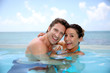 Photo: Couple having fun in swimming-pool Couple having fun in swimming-pool
