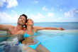 Couple relaxing in swimming pool