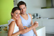 Cheerful couple enjoying breakfast time