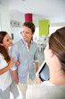 Foto: Couple visiting home with real-estate agent Couple visiting home with real-estate agent