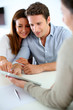 Young couple meeting financial adviser